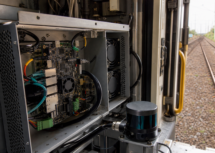 rugged Jetson carrier board and LiDAR edge computer installed inside a rail inspection vehicle in a realistic LiDAR application scene