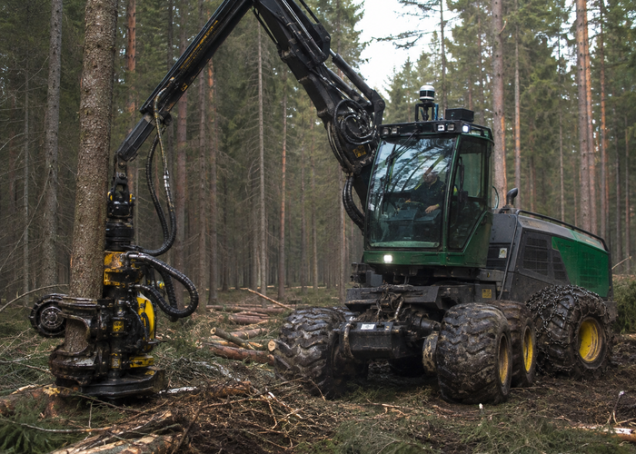 forestry harvester with a physical 3D LiDAR sensor working among tree stems and slash in a realistic LiDAR application scene