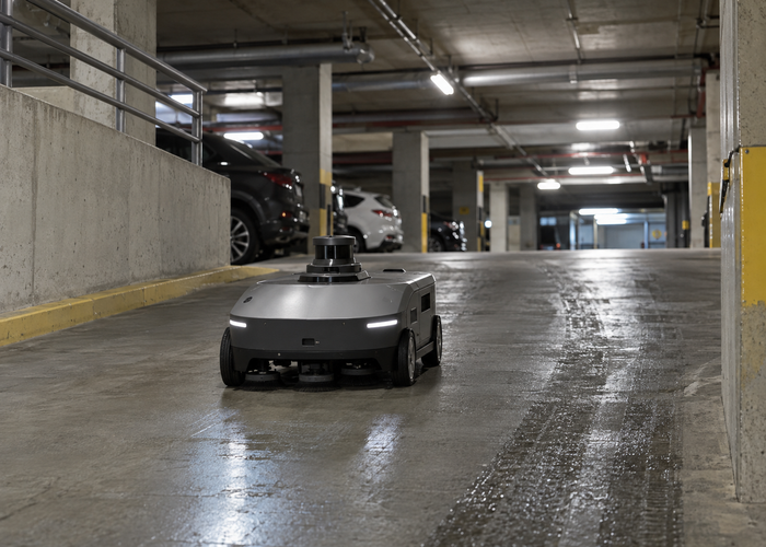 compact autonomous cleaning and inspection robot with physical LiDAR navigating a realistic underground parking garage ramp among concrete pillars and parked cars in a realistic LiDAR application scene