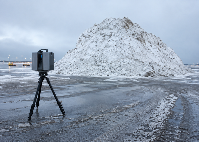 LiDAR survey system measuring large airport snow piles in a designated disposal area in a realistic LiDAR application scene