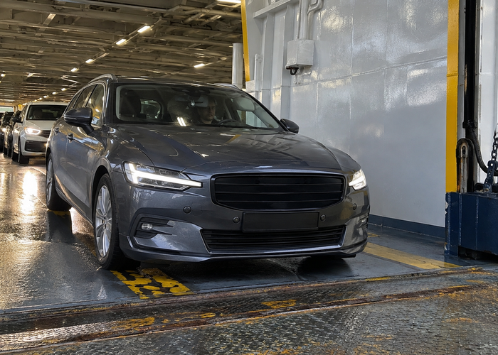 real vehicle ferry car deck with cars, ramp and an unbranded physical LiDAR parking sensor during supervised loading validation scene 2