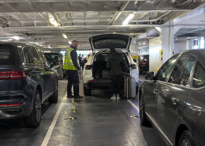 real vehicle ferry car deck with cars, ramp and an unbranded physical LiDAR parking sensor during supervised loading validation scene 3