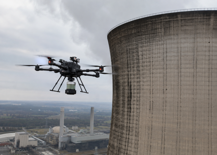 inspection drone using physical LiDAR beside a large industrial cooling tower in a realistic LiDAR application scene